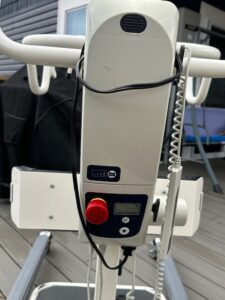 close up view of controls with large red knob and a remote on a cord
