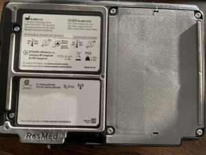 Back of CPAP machine. There are two labels on the machine that display storage and transport ranges and general manufacturer information.
