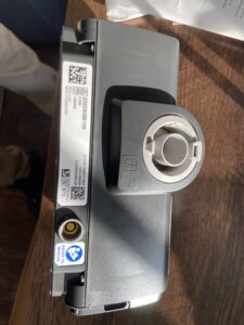 Side of CPAP machine, showing the connection point for the mask.