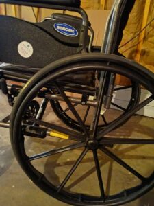 close up picture of large wheel on wheelchair
