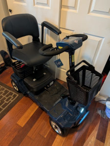 Blue mobility scooter with black seat and trim. Gently used condition.