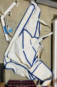 White lift hammock with blue trim.