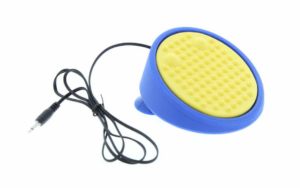 Circular yellow switch with lots of small bumps. Switch has a blue base that tilts the switch at a slight angle.