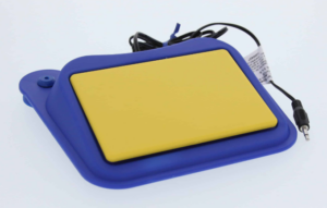 Yellow rectangular switch with a blue border and base. The base tilts the switch at a slight angle. The surface of the switch is flat and smooth.