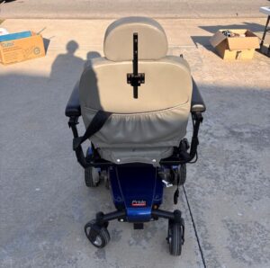 Back view of power chair. There is a large pocket on the back of the seat.