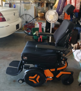 Side view of power chair. “F3” is on the base.