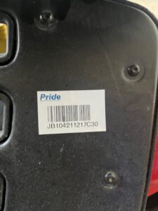 Barcode sticker underneath base of power wheelchair.