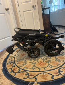 Side view of wheelchair when folded up.