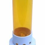 Yellow opaque cylinder with round white cap on top with text that says “push down and turn”, “open” and “close” along with arrows indicating the correct direction.