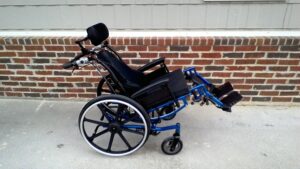 side view displaying the manual wheelchair tilting back