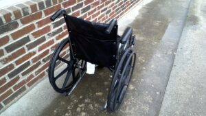 back view of a manual wheelchair with handles to push